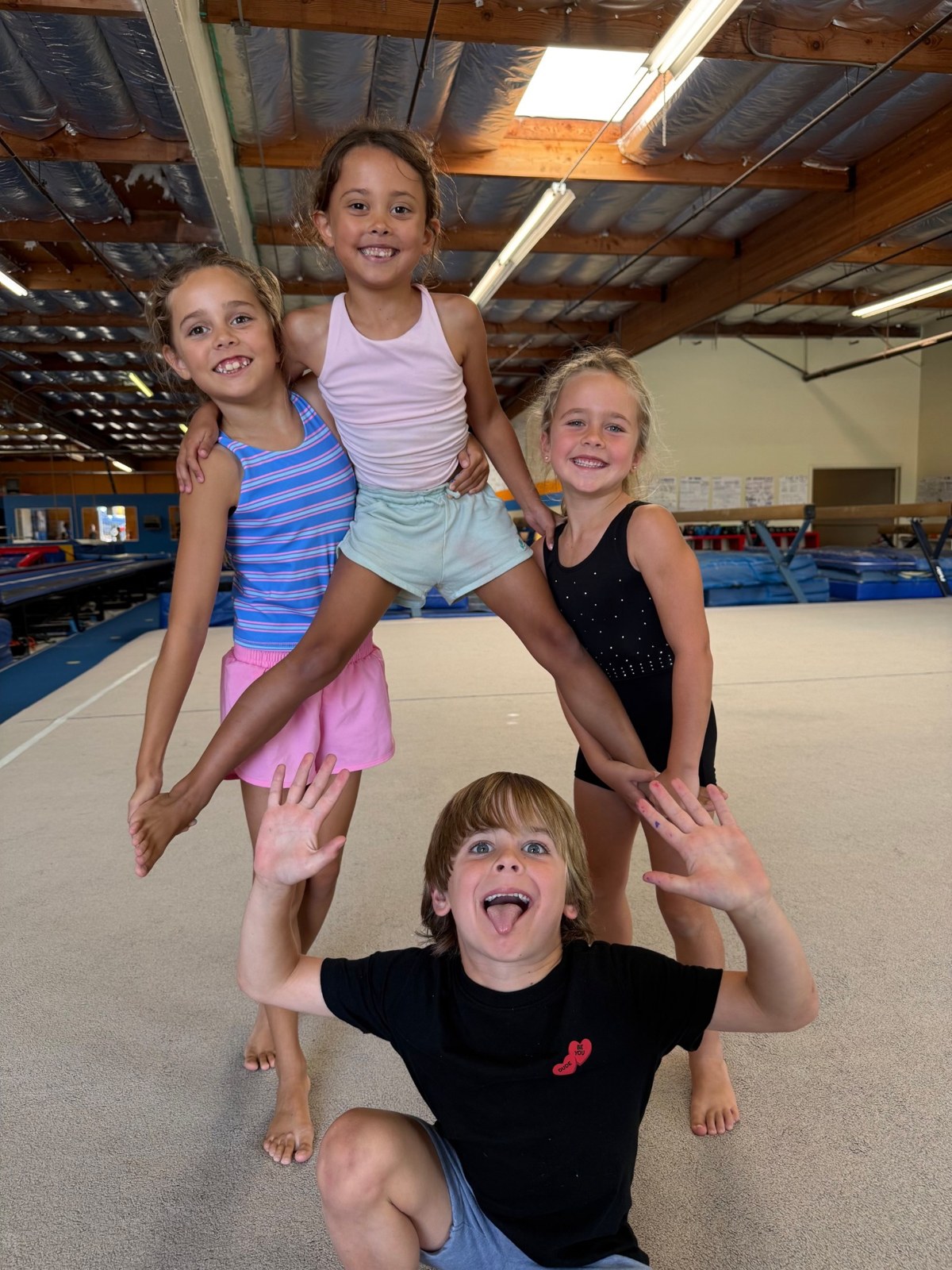 Athletes posing together at the gym
