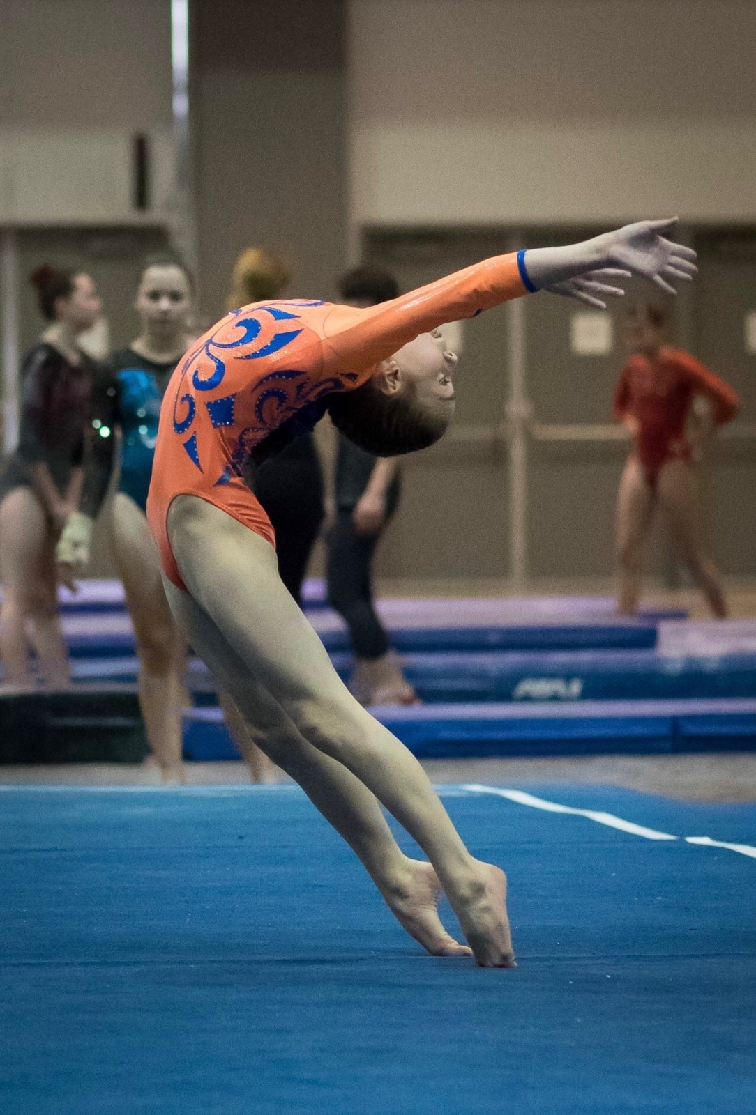 Gymnast jumping during a floor exercise